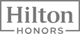 The image shows the Hilton Honors logo, featuring the word "Hilton" above "Honors" in a bold font with a rectangular border.