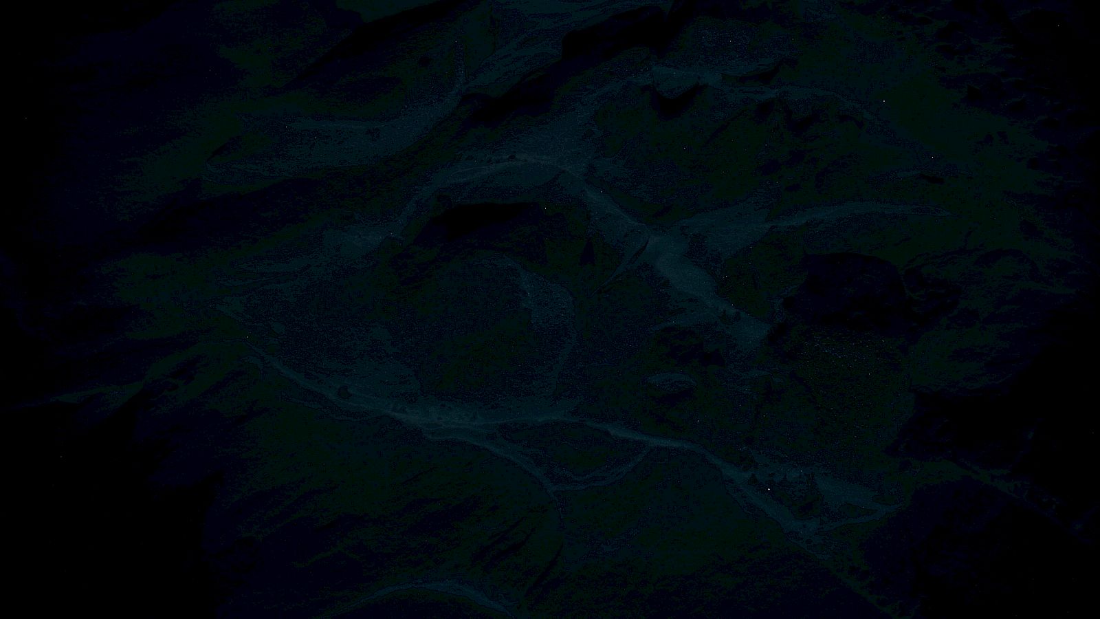 The image is very dark, making it unclear to identify distinct objects or features in it.
